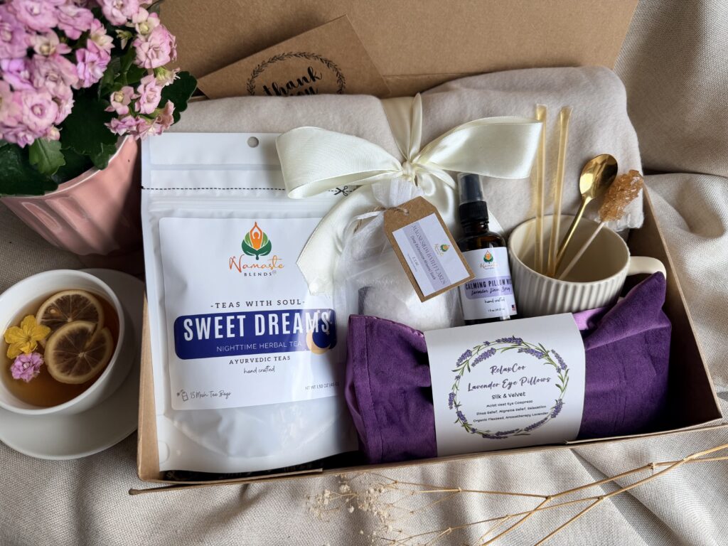 The Sweet Dreams Ritual Box is a luxurious bedtime gift designed to inspire peaceful evenings and comforting self-care rituals. Featuring our handcrafted Sweet Dreams Herbal Tea, a soft throw blanket, lavender eye pillow, magnesium bath flakes, calming pillow mist, ceramic tea mug, gold spoon, honey stick, and sugar stick, this beautifully curated collection creates the perfect nighttime tea experience. This premium gift set includes 15 food-grade mesh tea bags filled with our naturally caffeine-free botanical blend, handcrafted in small batches by Namaste Blends. Beautifully packaged and ready to gift, it's the perfect choice for birthdays, Mother's Day, holidays, thank-you gifts, or anyone who enjoys cozy evenings, botanical teas, and intentional bedtime rituals.
