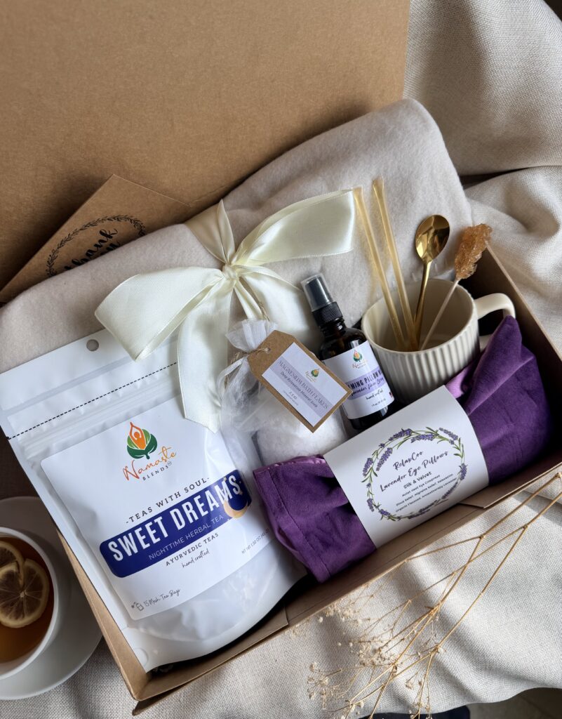 The Sweet Dreams Ritual Box is a luxurious bedtime gift designed to inspire peaceful evenings and comforting self-care rituals. Featuring our handcrafted Sweet Dreams Herbal Tea, a soft throw blanket, lavender eye pillow, magnesium bath flakes, calming pillow mist, ceramic tea mug, gold spoon, honey stick, and sugar stick, this beautifully curated collection creates the perfect nighttime tea experience. This premium gift set includes 15 food-grade mesh tea bags filled with our naturally caffeine-free botanical blend, handcrafted in small batches by Namaste Blends. Beautifully packaged and ready to gift, it's the perfect choice for birthdays, Mother's Day, holidays, thank-you gifts, or anyone who enjoys cozy evenings, botanical teas, and intentional bedtime rituals.