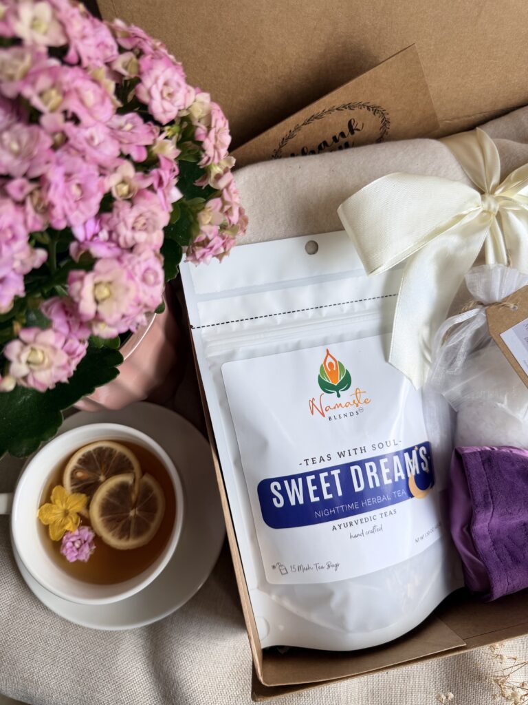 The Sweet Dreams Ritual Box is a luxurious bedtime gift designed to inspire peaceful evenings and comforting self-care rituals. Featuring our handcrafted Sweet Dreams Herbal Tea, a soft throw blanket, lavender eye pillow, magnesium bath flakes, calming pillow mist, ceramic tea mug, gold spoon, honey stick, and sugar stick, this beautifully curated collection creates the perfect nighttime tea experience. This premium gift set includes 15 food-grade mesh tea bags filled with our naturally caffeine-free botanical blend, handcrafted in small batches by Namaste Blends. Beautifully packaged and ready to gift, it's the perfect choice for birthdays, Mother's Day, holidays, thank-you gifts, or anyone who enjoys cozy evenings, botanical teas, and intentional bedtime rituals.