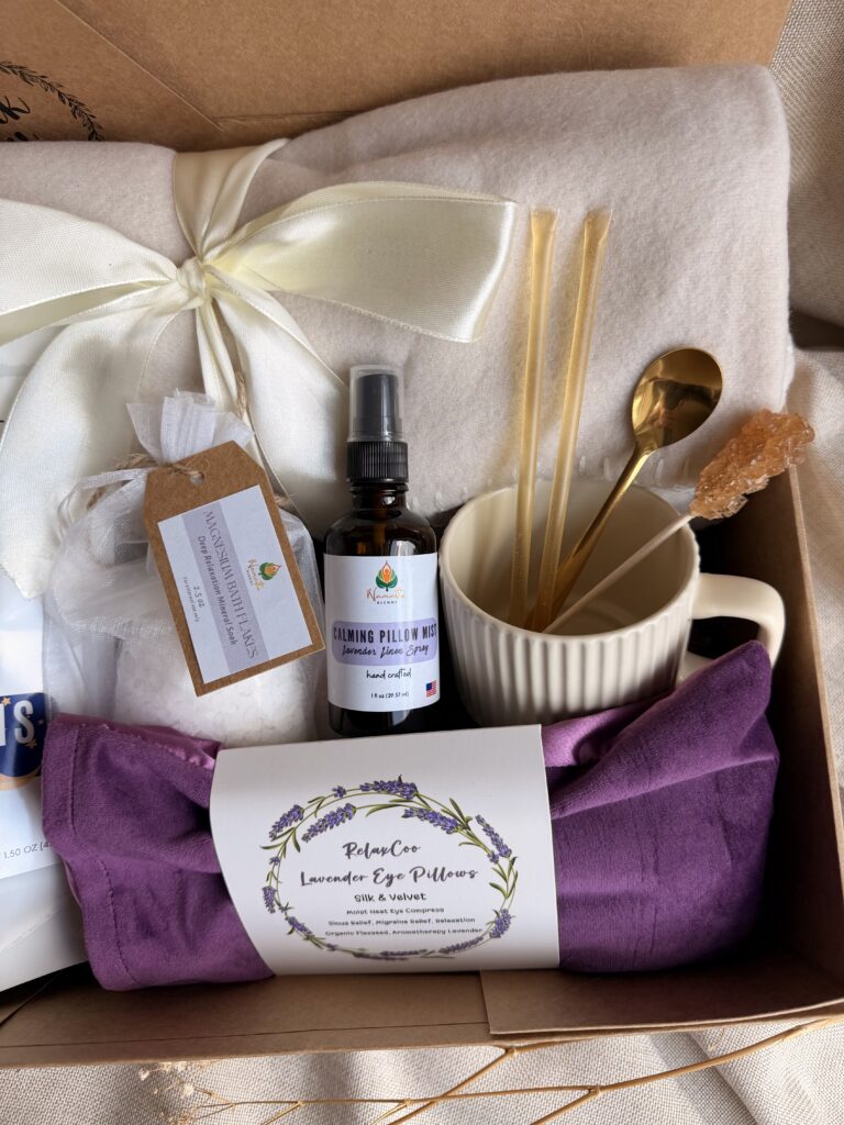 The Sweet Dreams Ritual Box is a luxurious bedtime gift designed to inspire peaceful evenings and comforting self-care rituals. Featuring our handcrafted Sweet Dreams Herbal Tea, a soft throw blanket, lavender eye pillow, magnesium bath flakes, calming pillow mist, ceramic tea mug, gold spoon, honey stick, and sugar stick, this beautifully curated collection creates the perfect nighttime tea experience. This premium gift set includes 15 food-grade mesh tea bags filled with our naturally caffeine-free botanical blend, handcrafted in small batches by Namaste Blends. Beautifully packaged and ready to gift, it's the perfect choice for birthdays, Mother's Day, holidays, thank-you gifts, or anyone who enjoys cozy evenings, botanical teas, and intentional bedtime rituals.
