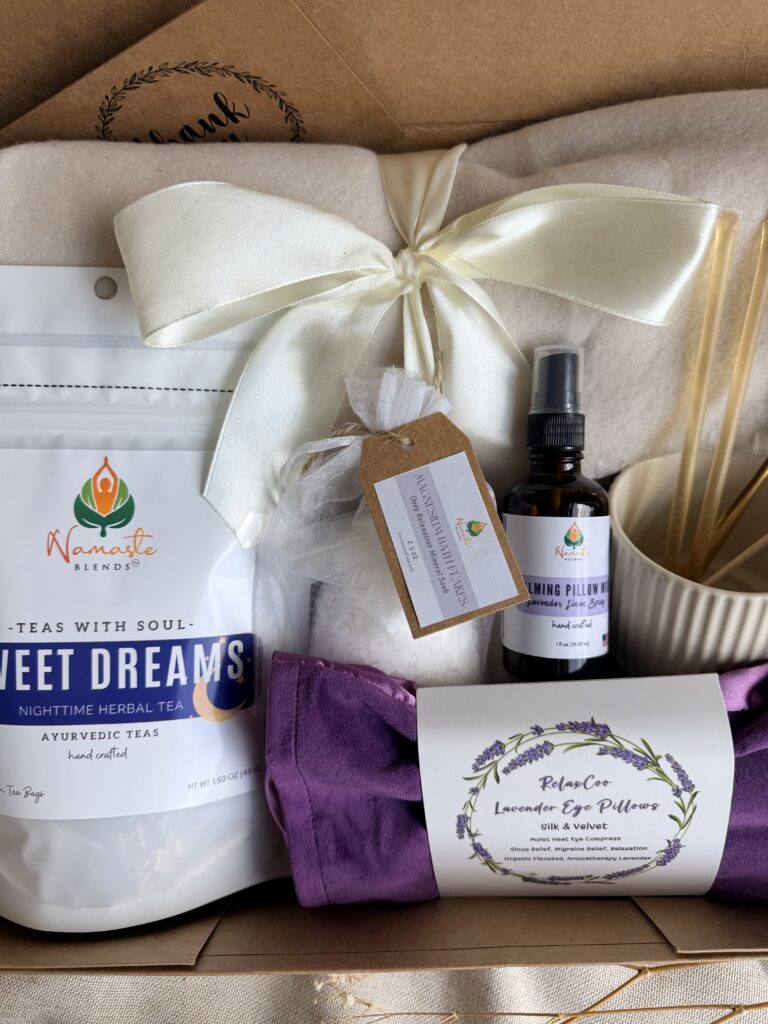 The Sweet Dreams Ritual Box is a luxurious bedtime gift designed to inspire peaceful evenings and comforting self-care rituals. Featuring our handcrafted Sweet Dreams Herbal Tea, a soft throw blanket, lavender eye pillow, magnesium bath flakes, calming pillow mist, ceramic tea mug, gold spoon, honey stick, and sugar stick, this beautifully curated collection creates the perfect nighttime tea experience. This premium gift set includes 15 food-grade mesh tea bags filled with our naturally caffeine-free botanical blend, handcrafted in small batches by Namaste Blends. Beautifully packaged and ready to gift, it's the perfect choice for birthdays, Mother's Day, holidays, thank-you gifts, or anyone who enjoys cozy evenings, botanical teas, and intentional bedtime rituals.