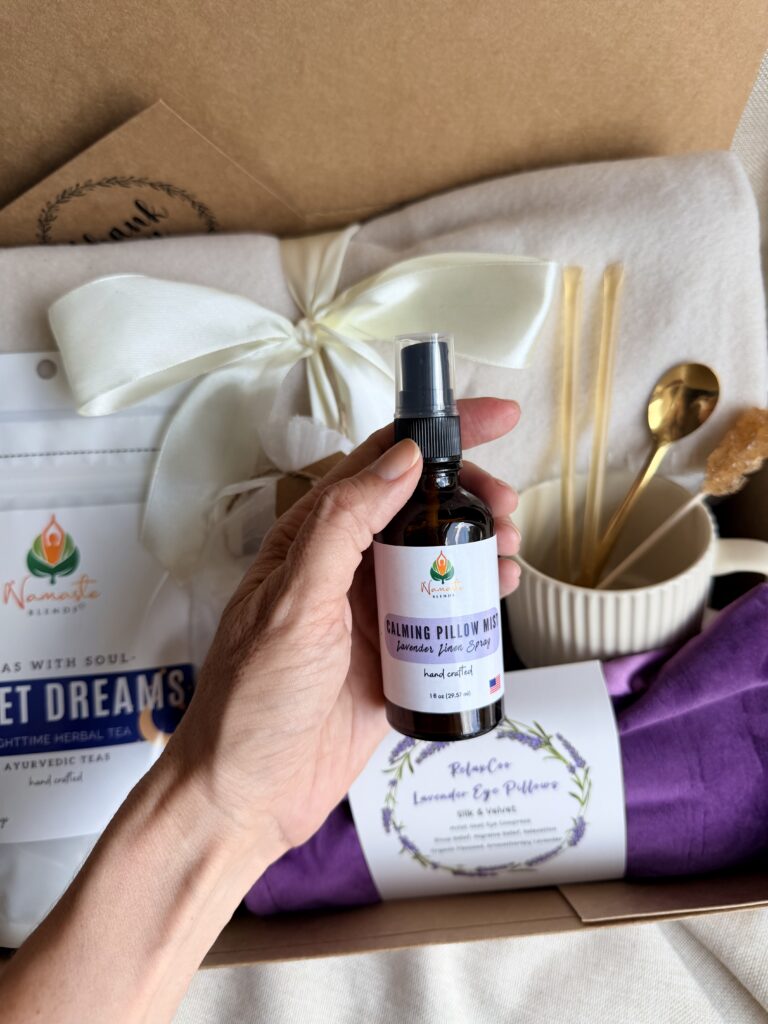 The Sweet Dreams Ritual Box is a luxurious bedtime gift designed to inspire peaceful evenings and comforting self-care rituals. Featuring our handcrafted Sweet Dreams Herbal Tea, a soft throw blanket, lavender eye pillow, magnesium bath flakes, calming pillow mist, ceramic tea mug, gold spoon, honey stick, and sugar stick, this beautifully curated collection creates the perfect nighttime tea experience. This premium gift set includes 15 food-grade mesh tea bags filled with our naturally caffeine-free botanical blend, handcrafted in small batches by Namaste Blends. Beautifully packaged and ready to gift, it's the perfect choice for birthdays, Mother's Day, holidays, thank-you gifts, or anyone who enjoys cozy evenings, botanical teas, and intentional bedtime rituals.
