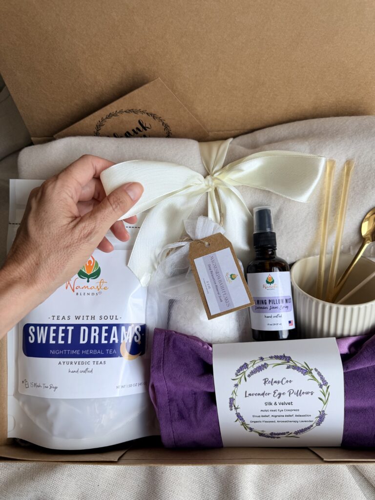 The Sweet Dreams Ritual Box is a luxurious bedtime gift designed to inspire peaceful evenings and comforting self-care rituals. Featuring our handcrafted Sweet Dreams Herbal Tea, a soft throw blanket, lavender eye pillow, magnesium bath flakes, calming pillow mist, ceramic tea mug, gold spoon, honey stick, and sugar stick, this beautifully curated collection creates the perfect nighttime tea experience. This premium gift set includes 15 food-grade mesh tea bags filled with our naturally caffeine-free botanical blend, handcrafted in small batches by Namaste Blends. Beautifully packaged and ready to gift, it's the perfect choice for birthdays, Mother's Day, holidays, thank-you gifts, or anyone who enjoys cozy evenings, botanical teas, and intentional bedtime rituals.